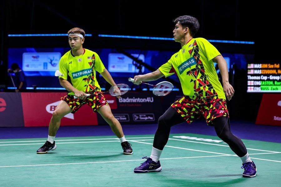Goh Sze Fei-Nur Izzuddin Rumsani in action against England’s Rory Easton-Zach Russ in their Thomas Cup match yesterday. PIC COURTESY OF BADMINTON PHOTO